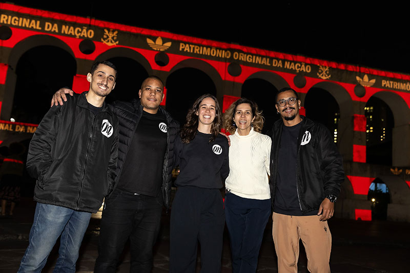 The ON team standing in front of the historic Arcos da Lapa monument in Rio de Janeiro