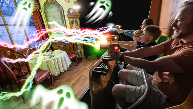 Attendees and projected ghosts at the Ghostly Manor attraction. Photo credit: Paultons Park.
