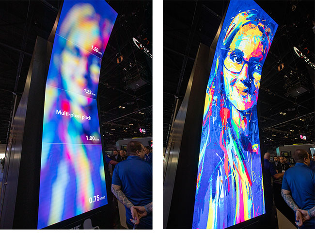 Two tall, slightly curved LED video wall displays beside each other showing the image of a woman&rsquo;s face blurry on one, and in high resolution on the other.