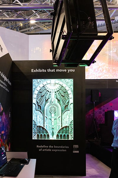 A large piece of wood carved art is projection mapped with a 1DLP laser projector.