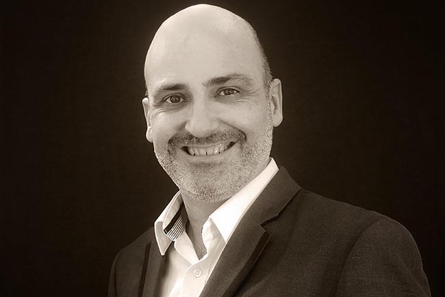 A black and white headshot of Wavetrain Cinema&rsquo;s managing director David Moseley. 