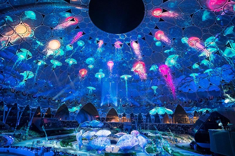 A large dome is projection mapped with jellyfish.