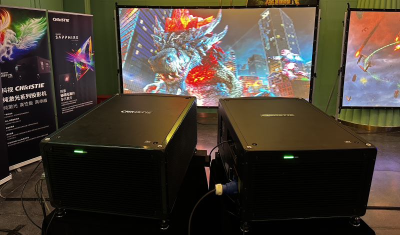 Two ProAV projectors illuminate a large screen with vibrant visuals.