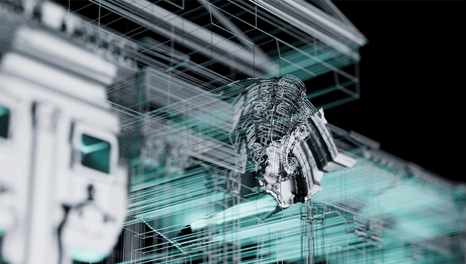 Fa&ccedil;ade of building at night lit up with projection mapping installation.